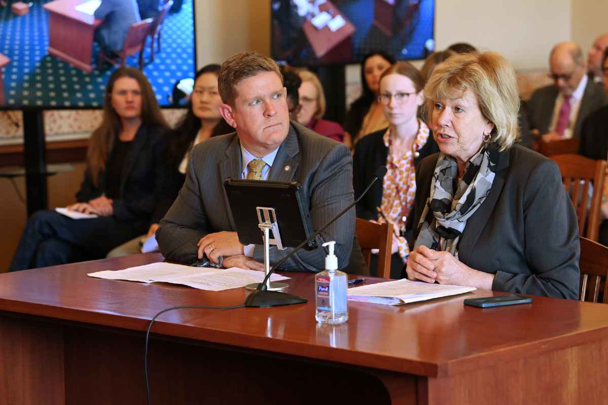 Senator Morrison seated next to Illinois State Police Director Brendan Kelly during a committee hearing.