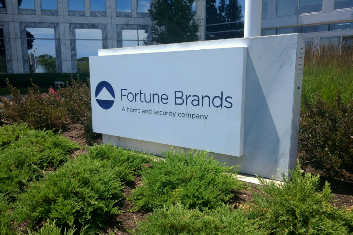A sign outside a building that says Fortune Brands, a home and security company.